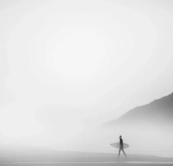 A man walking during fog
