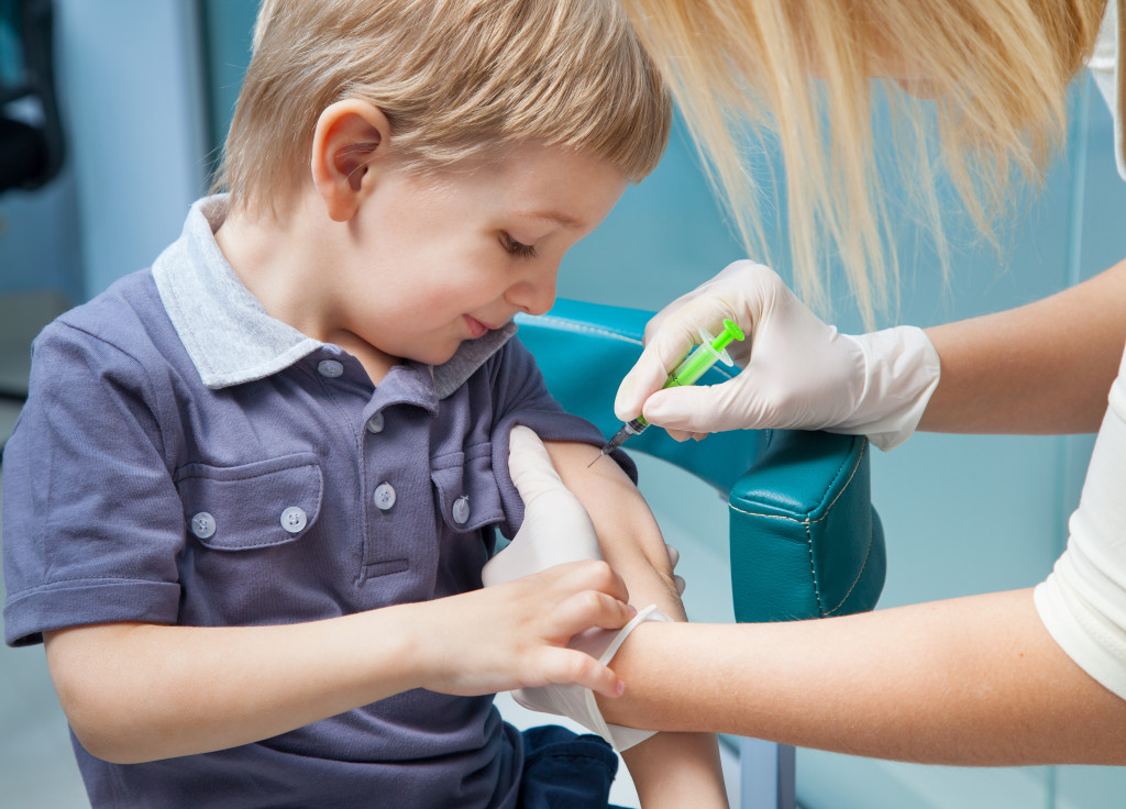 A little boy being vaccinated